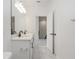 Modern bathroom with double vanity and marble-look tile floors at 5648 Green Arrow Pl, Sanford, FL 32773