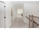 Upstairs hallway with carpet and access to bedrooms and bathroom at 5648 Green Arrow Pl, Sanford, FL 32773