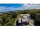 Aerial view of a new house under construction near the water at 71 E Lake Shore Blvd, Kissimmee, FL 34744