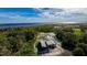 Aerial view of a house under construction with waterfront access at 71 E Lake Shore Blvd, Kissimmee, FL 34744