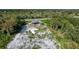Aerial view of a house frame under construction in a wooded area at 71 E Lake Shore Blvd, Kissimmee, FL 34744