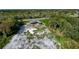 Aerial view of a house frame under construction in a wooded area at 71 E Lake Shore Blvd, Kissimmee, FL 34744