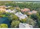 Aerial view of community, showing building rooftops and lake at 8807 Villa View Cir # 107, Orlando, FL 32821