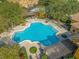 Inviting community pool with lounge chairs at 8807 Villa View Cir # 107, Orlando, FL 32821