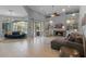 Open living area with fireplace, sectional sofa, and access to pool at 9810 Camberley Cir, Orlando, FL 32836