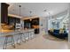 Modern kitchen with dark cabinets, granite counters, and island at 9810 Camberley Cir, Orlando, FL 32836