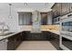 Updated kitchen with stainless steel appliances and granite countertops at 9810 Camberley Cir, Orlando, FL 32836