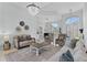 Spacious living room with comfortable seating and large windows at 9810 Camberley Cir, Orlando, FL 32836