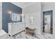 Modern bathroom with white vanity, marble floors, and a frameless mirror at 9810 Camberley Cir, Orlando, FL 32836