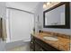 Simple bathroom with granite countertop and single vanity at 9810 Camberley Cir, Orlando, FL 32836