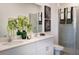 Modern bathroom with double sinks, a walk-in shower, and stylish decor at 2509 Raghav Trail Rd, Tavares, FL 32778