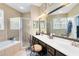 Spacious primary bathroom with double vanity, soaking tub, glass shower, and tile flooring at 2815 Crane Trace Cir, Orlando, FL 32837