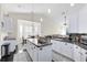 Bright and airy kitchen with an island, breakfast nook, and white cabinets at 2815 Crane Trace Cir, Orlando, FL 32837