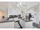 Modern kitchen with white cabinets, granite countertops, and stainless steel appliances at 2815 Crane Trace Cir, Orlando, FL 32837