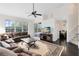 Spacious living room with high ceilings, large windows, and views of the dining area at 2815 Crane Trace Cir, Orlando, FL 32837
