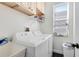 Laundry room with washer, dryer, cabinets, and sink at 2815 Crane Trace Cir, Orlando, FL 32837