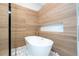 Luxurious bathroom featuring a freestanding tub and white stone at 5646 Masters Blvd, Orlando, FL 32819
