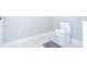 Modern bathroom with white toilet and marble floor at 5646 Masters Blvd, Orlando, FL 32819