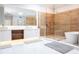 Elegant bathroom featuring double vanity, large mirror, and frameless shower at 5646 Masters Blvd, Orlando, FL 32819
