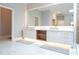 Modern bathroom with double vanity and a large mirror at 5646 Masters Blvd, Orlando, FL 32819