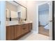 Modern bathroom with double vanity and a view of bedroom at 5646 Masters Blvd, Orlando, FL 32819