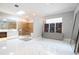Luxurious bathroom with marble floors, soaking tub, and walk-in shower at 5646 Masters Blvd, Orlando, FL 32819