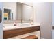 Modern bathroom with a floating vanity and a sleek gold faucet at 5646 Masters Blvd, Orlando, FL 32819