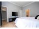 Bright bedroom with a queen-size bed, walk-in closet, and TV at 5646 Masters Blvd, Orlando, FL 32819