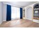 Bright bedroom with built-in shelving and hardwood floors at 5646 Masters Blvd, Orlando, FL 32819