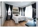 Bright bedroom with a comfortable bed and large windows at 5646 Masters Blvd, Orlando, FL 32819