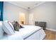 Bedroom with a queen bed and view into bathroom at 5646 Masters Blvd, Orlando, FL 32819