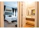 Spacious bedroom with ensuite bathroom and modern decor at 5646 Masters Blvd, Orlando, FL 32819