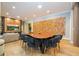 Modern dining room with a sleek wooden table and velvet chairs at 5646 Masters Blvd, Orlando, FL 32819