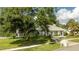 House's front view, showcasing landscaping and driveway at 5646 Masters Blvd, Orlando, FL 32819