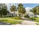 Single-story home with palm trees and landscaped yard at 5646 Masters Blvd, Orlando, FL 32819