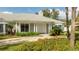 Front view of the house with white columns and landscaping at 5646 Masters Blvd, Orlando, FL 32819