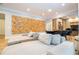 Spacious living room showcasing a modern sectional and statement art piece at 5646 Masters Blvd, Orlando, FL 32819