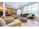 Bright living room with comfortable seating and a modern fire pit table at 5646 Masters Blvd, Orlando, FL 32819