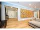 Living room with large artwork and hardwood floors at 5646 Masters Blvd, Orlando, FL 32819