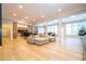 Open concept living area with hardwood floors and modern furniture at 5646 Masters Blvd, Orlando, FL 32819