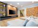 Open living area with sectional sofa, fireplace, and large-scale artwork at 5646 Masters Blvd, Orlando, FL 32819