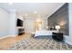 Main bedroom with TV, sitting area, and hardwood floors at 5646 Masters Blvd, Orlando, FL 32819