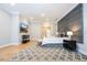 Main bedroom with TV, sitting area, and hardwood floors at 5646 Masters Blvd, Orlando, FL 32819