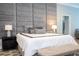 Main bedroom with gray upholstered headboard and plush bedding at 5646 Masters Blvd, Orlando, FL 32819