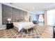 Main bedroom with plush carpet, large bed, and sitting area at 5646 Masters Blvd, Orlando, FL 32819