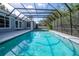 Refreshing screened-in pool with clear water at 5646 Masters Blvd, Orlando, FL 32819