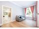 Bedroom sitting area with gray couch and large windows at 5646 Masters Blvd, Orlando, FL 32819