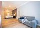 Sitting area with gray couch and view into main bedroom at 5646 Masters Blvd, Orlando, FL 32819