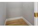 Small storage room with light grey walls and light brown laminate flooring at 5646 Masters Blvd, Orlando, FL 32819