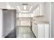 Modern kitchen featuring white cabinets and granite countertops at 161 Laurel Way, Kissimmee, FL 34743